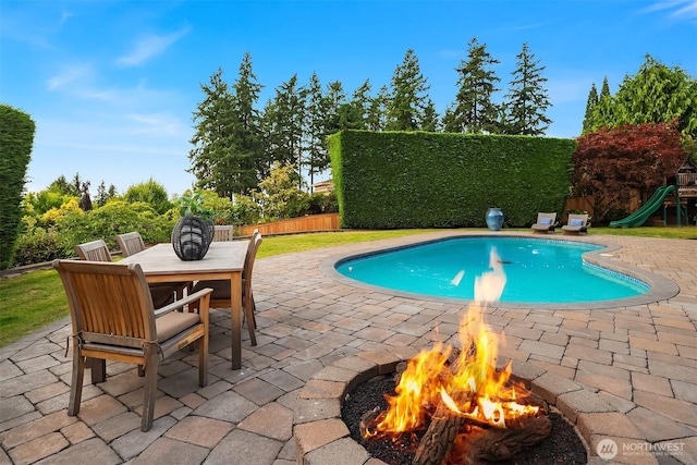 9620 NE 28th St, Clyde Hill, WA 98004 - view of pool with a fire pit, a patio area, a fenced backyard, and outdoor dining space