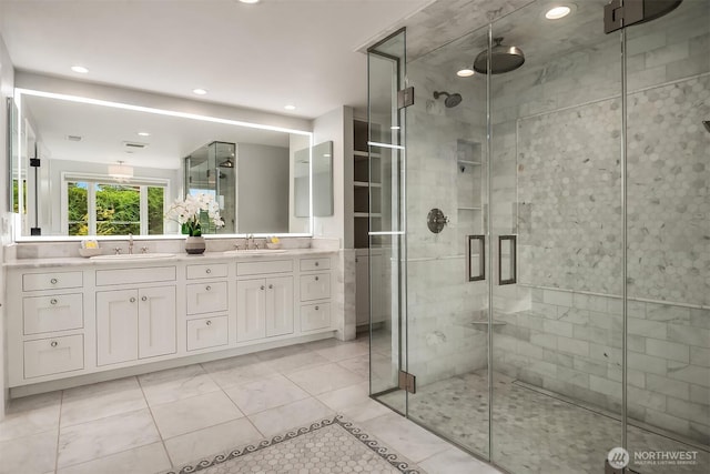 9620 NE 28th St, Clyde Hill, WA 98004 - bathroom featuring a stall shower, double vanity, recessed lighting, and tile patterned flooring