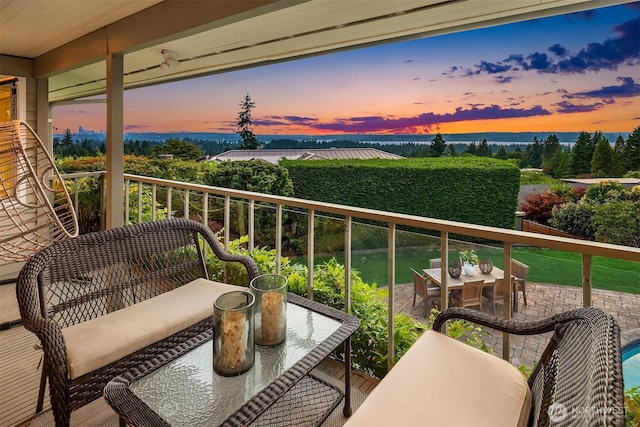 9620 NE 28th St, Clyde Hill, WA 98004 - balcony at dusk featuring a water view and outdoor dining area