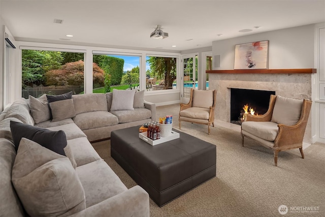 9620 NE 28th St, Clyde Hill, WA 98004 - carpeted living room with plenty of natural light, a premium fireplace, and recessed lighting