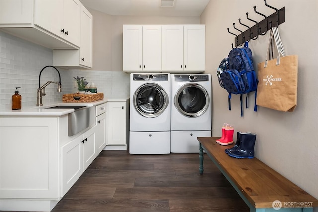 9620 NE 28th St, Clyde Hill, WA 98004 - laundry area featuring separate washer and dryer, cabinet space, and dark wood finished floors