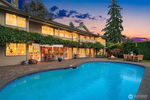 9620 NE 28th St, Clyde Hill, WA 98004 - swimming pool featuring a patio area and an outdoor fire pit