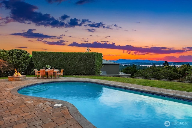 9620 NE 28th St, Clyde Hill, WA 98004 - swimming pool with a fire pit, a patio, and a lawn