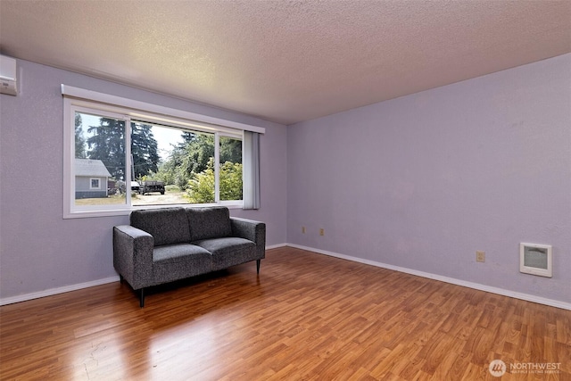 2059 Beverly Blvd, Shelton, WA 98584 - living area with light wood-type flooring and a textured ceiling