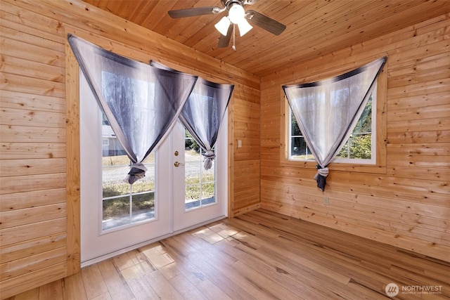 2059 Beverly Blvd, Shelton, WA 98584 - doorway to outside with healthy amount of natural light, wooden ceiling, hardwood / wood-style flooring, a ceiling fan, and wooden walls
