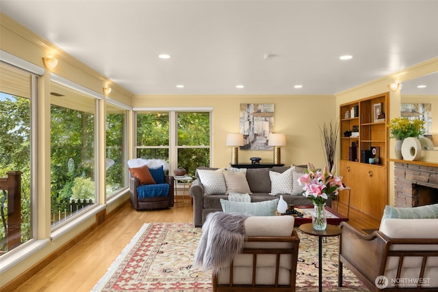 3912 NE 127th St, Seattle, WA 98125 - living area with ornamental molding, wood finished floors, a fireplace, and recessed lighting
