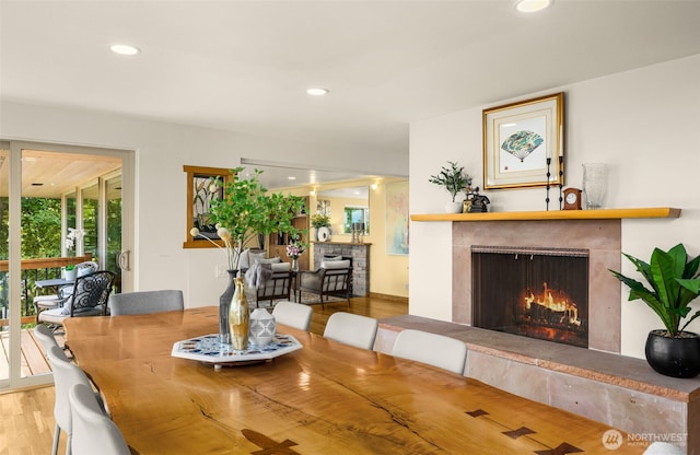 3912 NE 127th St, Seattle, WA 98125 - dining space featuring wood finished floors, a high end fireplace, and recessed lighting