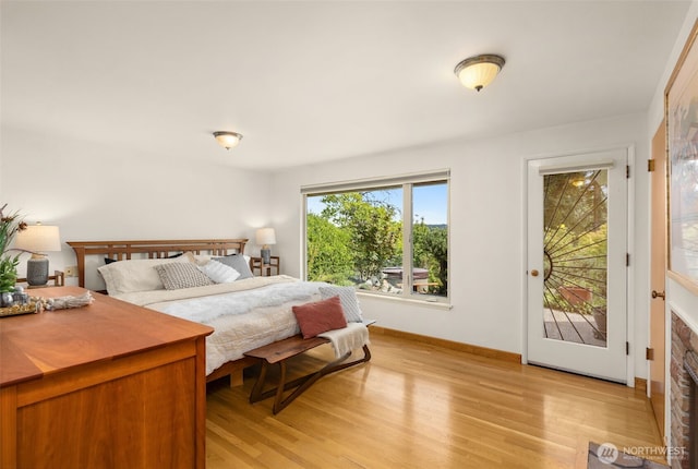 3912 NE 127th St, Seattle, WA 98125 - bedroom with light wood-type flooring and access to outside