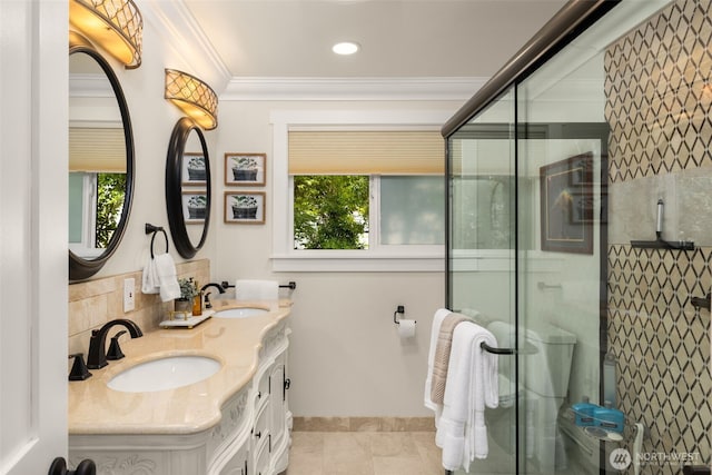 3912 NE 127th St, Seattle, WA 98125 - bathroom with double vanity, a shower stall, ornamental molding, tile patterned flooring, and recessed lighting