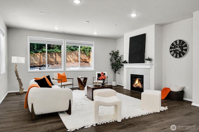 3941 233rd St SE, Bothell, WA 98021 - living room featuring a tiled fireplace, dark wood finished floors, and recessed lighting