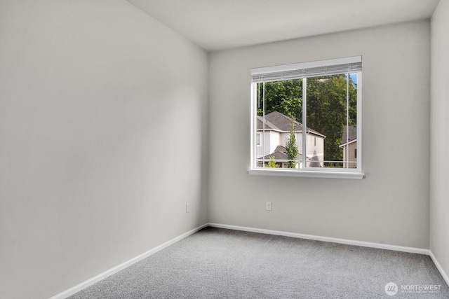 3941 233rd St SE, Bothell, WA 98021 - spare room featuring baseboards and carpet