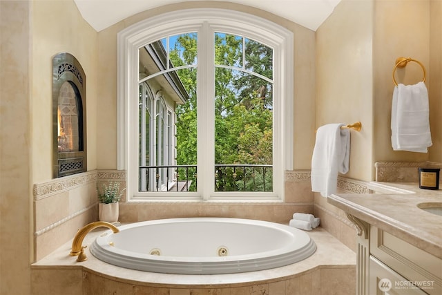3210 Hunts Point Rd, Hunts Point, WA 98004 - bathroom featuring healthy amount of natural light, a whirlpool tub, vanity, and lofted ceiling