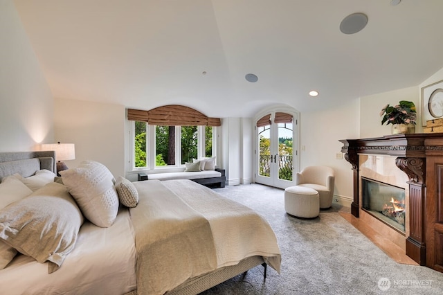 3210 Hunts Point Rd, Hunts Point, WA 98004 - bedroom with access to outside, a high end fireplace, multiple windows, vaulted ceiling, and recessed lighting