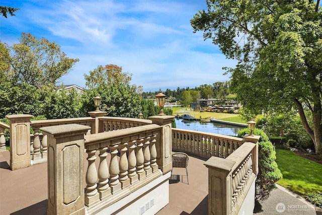 3210 Hunts Point Rd, Hunts Point, WA 98004 - wooden terrace with a water view