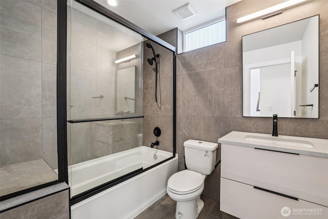 805 Taylor Ave N Unit D, Seattle, WA 98109 - bathroom with vanity, combined bath / shower with glass door, tile walls, and tile patterned flooring