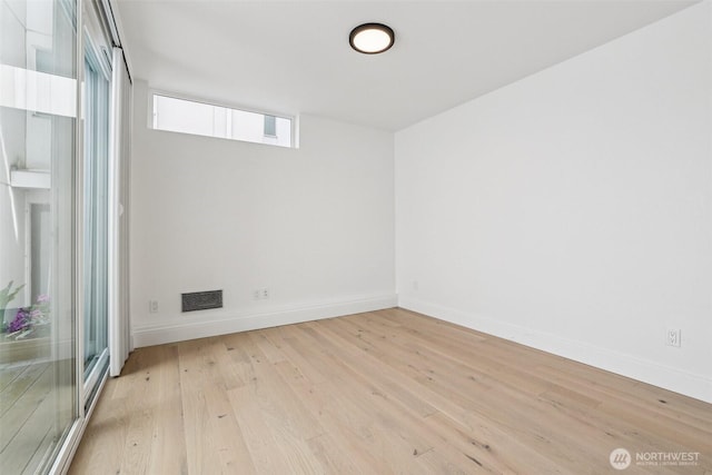 805 Taylor Ave N Unit D, Seattle, WA 98109 - empty room featuring light wood-style flooring and baseboards