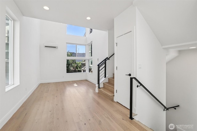 805 Taylor Ave N Unit D, Seattle, WA 98109 - interior space featuring light wood-type flooring, recessed lighting, stairway, and a wall mounted AC