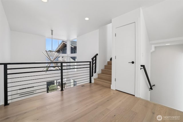 805 Taylor Ave N Unit D, Seattle, WA 98109 - staircase with wood finished floors, recessed lighting, a chandelier, and a wall of windows