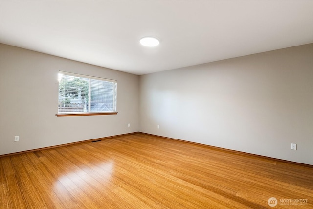 5983 Honeycutt Ct, Ferndale, WA 98248 - unfurnished room with light wood-type flooring and baseboards