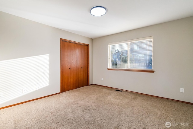 5983 Honeycutt Ct, Ferndale, WA 98248 - unfurnished bedroom with carpet floors and a closet
