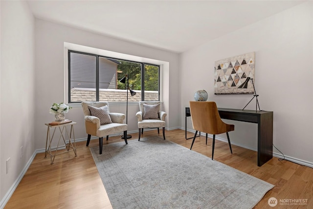 13573 Linden Ave N Unit 302, Seattle, WA 98133 - living area with light wood-style flooring and baseboards