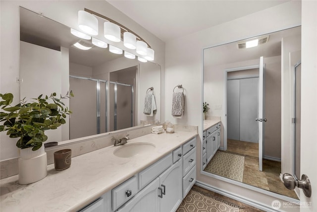 13573 Linden Ave N Unit 302, Seattle, WA 98133 - full bathroom featuring vanity, a stall shower, and tile patterned floors