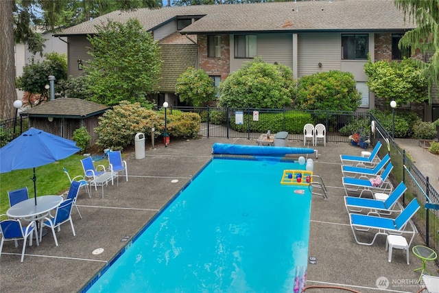 13573 Linden Ave N Unit 302, Seattle, WA 98133 - community pool featuring a patio area