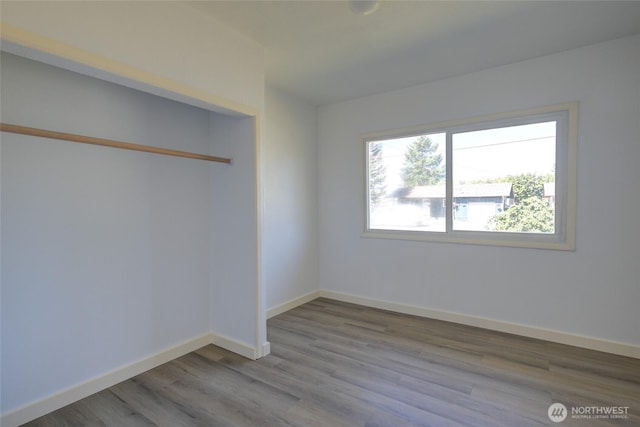 408 N 11th St, Elma, WA 98541 - empty room with wood finished floors and baseboards