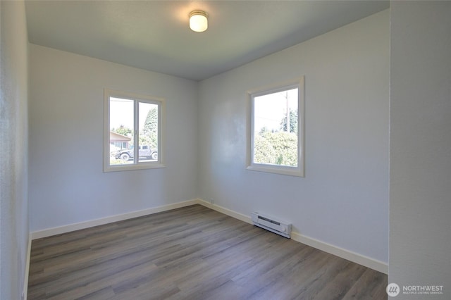 408 N 11th St, Elma, WA 98541 - unfurnished room featuring baseboard heating and wood finished floors