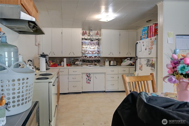 408 N 11th St, Elma, WA 98541 - kitchen featuring white appliances, under cabinet range hood, light countertops, white cabinetry, and light flooring