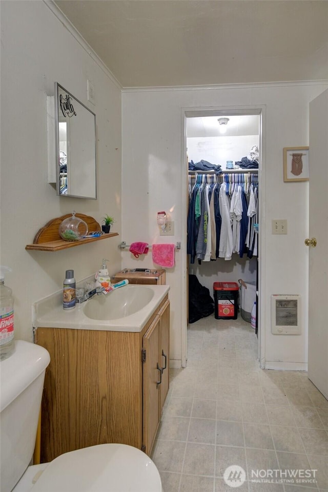 408 N 11th St, Elma, WA 98541 - bathroom featuring vanity, heating unit, and a walk in closet
