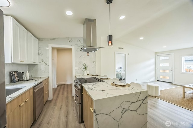 1322 Crescent Ave, Centralia, WA 98531 - kitchen featuring stainless steel appliances, island range hood, light wood-style floors, light stone countertops, and lofted ceiling