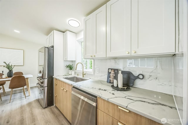 1322 Crescent Ave, Centralia, WA 98531 - kitchen featuring stainless steel appliances, light wood-type flooring, light stone countertops, and white cabinetry