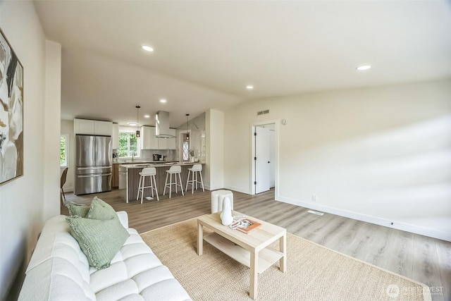 1322 Crescent Ave, Centralia, WA 98531 - living room featuring vaulted ceiling, light wood-style floors, and recessed lighting