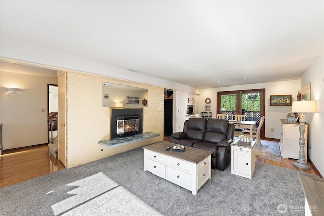 17310 Palatine Ave N, Shoreline, WA 98133 - living area with a glass covered fireplace and light wood-style flooring