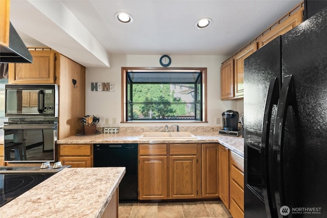 17310 Palatine Ave N, Shoreline, WA 98133 - kitchen with black appliances, light countertops, recessed lighting, and brown cabinets
