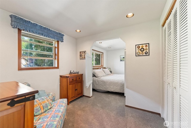 17310 Palatine Ave N, Shoreline, WA 98133 - bedroom featuring arched walkways, light colored carpet, a closet, multiple windows, and recessed lighting