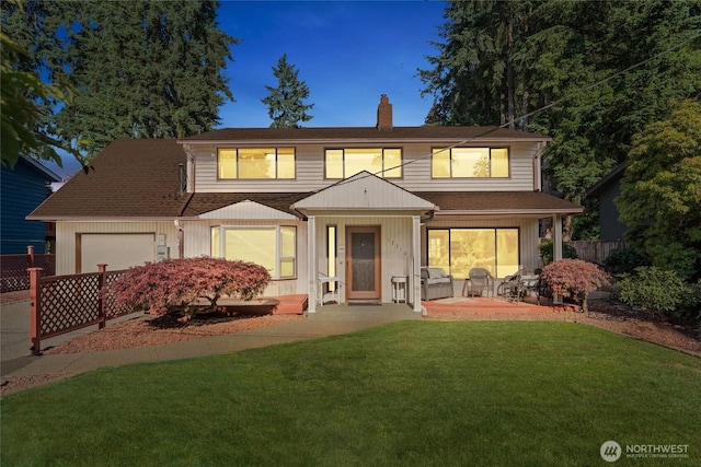 17310 Palatine Ave N, Shoreline, WA 98133 - traditional home with a chimney, an attached garage, and roof with shingles