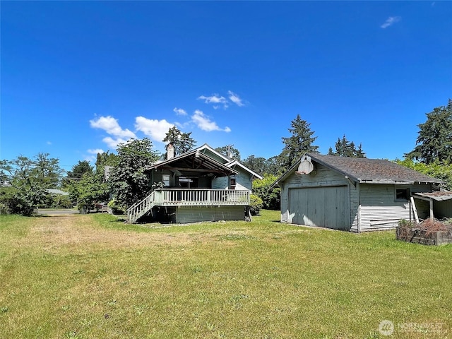 3320 90th St, Lakewood, WA 98499 - back of property with a lawn, a garage, and a storage shed
