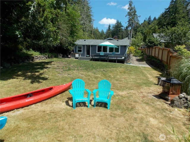 3223 Aspinwall Rd NW, Olympia, WA 98502 - view of grassy yard with a wooden deck and view of wooded area