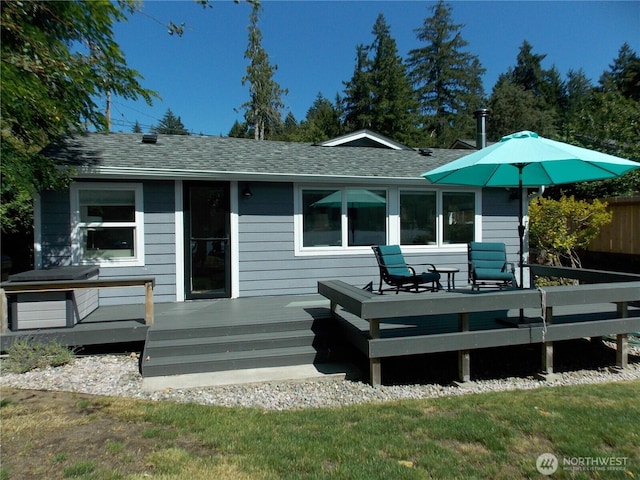 3223 Aspinwall Rd NW, Olympia, WA 98502 - rear view of property with a deck and a shingled roof