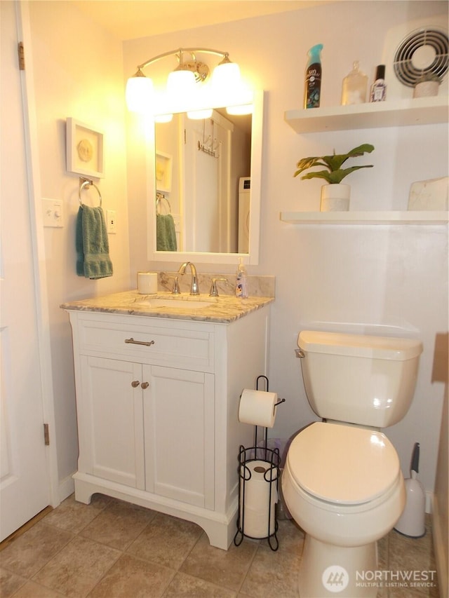 3223 Aspinwall Rd NW, Olympia, WA 98502 - bathroom featuring vanity, washer / clothes dryer, and tile patterned floors