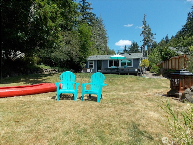 3223 Aspinwall Rd NW, Olympia, WA 98502 - view of green lawn with a wooden deck