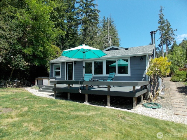 3223 Aspinwall Rd NW, Olympia, WA 98502 - view of front of property with a deck, a front lawn, and a shingled roof