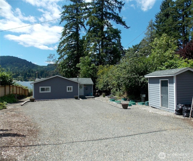 3223 Aspinwall Rd NW, Olympia, WA 98502 - back of property featuring a storage shed and driveway