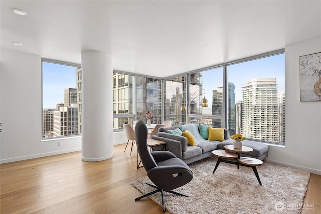 1808 Minor Ave Unit 3105, Seattle, WA 98101 - living room featuring a skyline view, plenty of natural light, and wood finished floors
