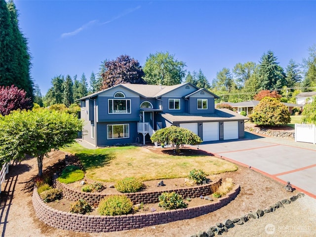 7332 156th St SE, Snohomish, WA 98296 - split foyer home with a garage, asphalt driveway, and a front lawn