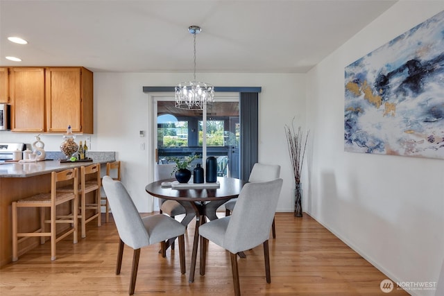 7332 156th St SE, Snohomish, WA 98296 - dining area with a chandelier, light wood finished floors, and recessed lighting