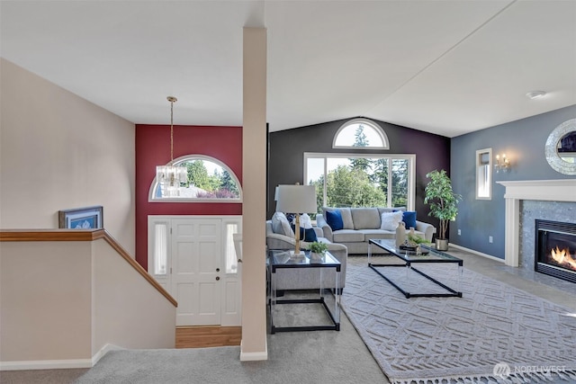 7332 156th St SE, Snohomish, WA 98296 - living room featuring carpet, vaulted ceiling, a fireplace, and plenty of natural light