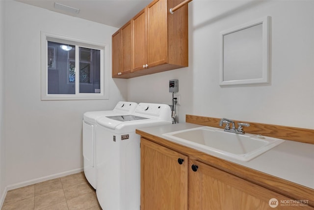 7332 156th St SE, Snohomish, WA 98296 - laundry room with washer and dryer, cabinet space, and light tile patterned floors